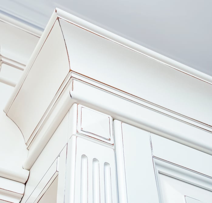 Close-up of crown moulding and cabinet trim detail